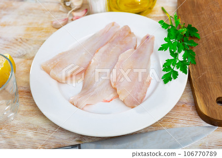 Fresh raw fillet of sea bass 106770789