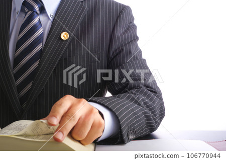 Male lawyer reading the complete book of the Six Codes Male lawyer reading the complete book of the Six Codes 106770944