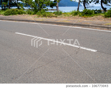 White dashed center line. White dashed center line. 106773043