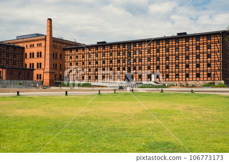 Former Rother Mills building complex made of characteristic brick and a half-timbered structure situated on the Mill Island Old town Bydgoszcz, Poland. Facade of the complex of ancient mills.  106773173
