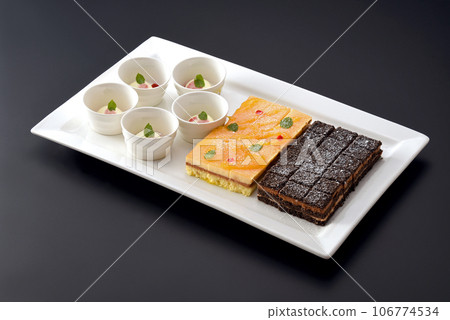 Delicious and fun sweets buffet/Sweets a la carte/Petit desserts served on white plates 106774534