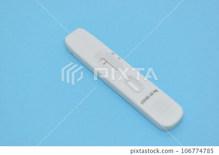 covid test kid on blue background covid test kid on blue background 106774785