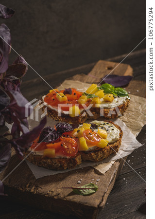 Italian bruschetta with roasted tomatoes 106775294