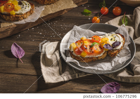 Italian bruschetta with roasted tomatoes 106775296