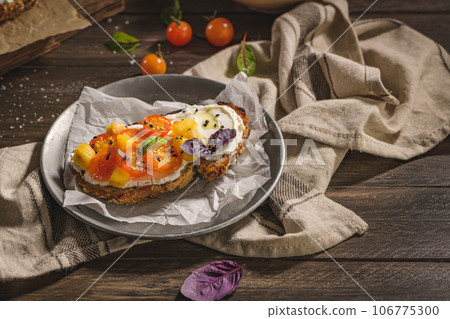 Italian bruschetta with roasted tomatoes 106775300