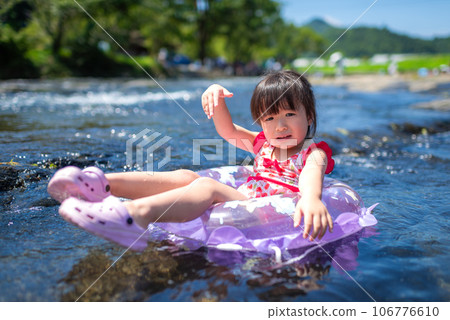 Girl playing in the natural river pool Girl playing in the natural river pool 106776610