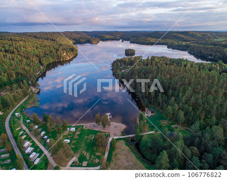 campsite camping caravan by lake Ragnerudssjoen in Dalsland Sweden beautiful nature forest pinetree 106776822