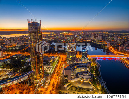 Yekaterinburg city and pond aerial panoramic view at summer or early autumn night. Night city in the early autumn or summer. 106777164