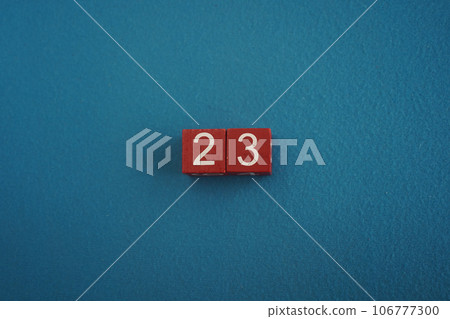 Wooden Viva Magenta cubes with number 23 blue background close-up top view. Concept of date time. White numbers 23 Wooden Viva Magenta cubes with number 23 blue background close-up top view. Concept of date time. White numbers 23 106777300