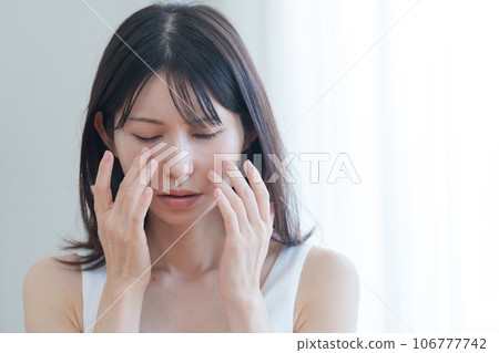 A woman worried about her face and eyes 106777742