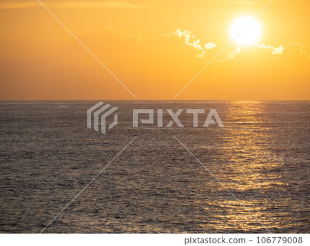 Sunset sky and calm sea (Pacific Ocean). From the coast in Muroto City, Kochi Prefecture in summer (August). Sunset sky and calm sea (Pacific Ocean). From the coast in Muroto City, Kochi Prefecture in summer (August). 106779008
