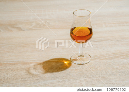 Cognac in sniffer glass Cognac in sniffer glass 106779302