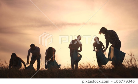 silhouette volunteers collect plastic. group team people collect plastic bottles sunset together. environmental protection business concept. volunteers family collect plastic lifestyle clean nature 106779346