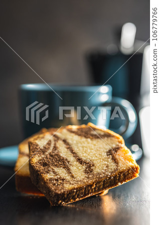 Marble sponge cake and coffee cup. Cake with cocoa and vanilla taste. Marble sponge cake and coffee cup. Cake with cocoa and vanilla taste. 106779766