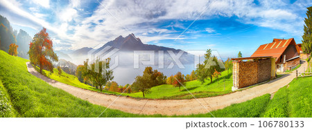 Captivating autumn view on suburb of Stansstad city and Lucerne lake with mountaines and fog Captivating autumn view on suburb of Stansstad city and Lucerne lake with mountaines and fog 106780133