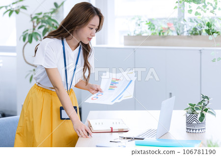 Business Young woman working on a computer Business Young woman working on a computer 106781190
