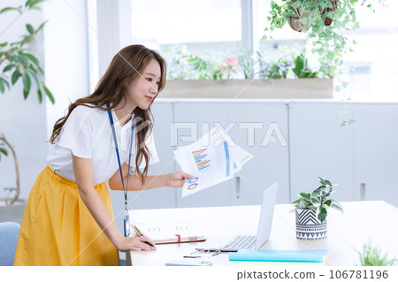 Business Young woman working on a computer 106781196