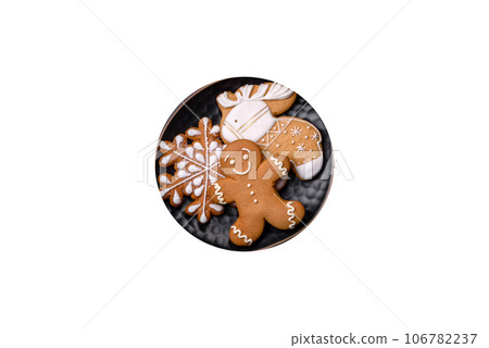 Beautiful different Christmas decorations and gingerbread on a brown concrete table 106782237
