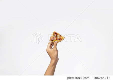 A human hand holding a slice of pizza A human hand holding a slice of pizza 106783212