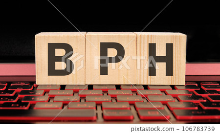 BPH Benign Prostatic Hyperplasia written on wooden cubes on the laptop keyboard BPH Benign Prostatic Hyperplasia written on wooden cubes on the laptop keyboard 106783739