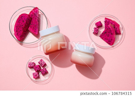 Slices of red dragon fruit placed inside glass petri dishes. Unbranded jars are featured for mockup. Vitamin A is another great vitamin found in Dragon fruit (Hylocereus) Slices of red dragon fruit placed inside glass petri dishes. Unbranded jars are featured for mockup. Vitamin A is another great vitamin found in Dragon fruit (Hylocereus) 106784315
