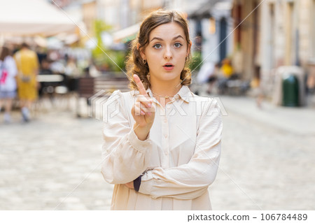 Displeased upset young woman girl reacting to unpleasant awful idea wave hand finger, shake head No 106784489