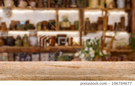Wooden Table with Abstract Blurred Pharmacy View. Ideal for product presentations or mockups. Wooden Table with Abstract Blurred Pharmacy View. Ideal for product presentations or mockups. 106784677