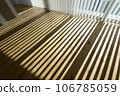 Sunlight shining into the room and shadows from the blinds 106785059