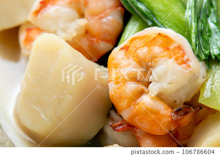 A close-up of stir-fried shrimp, scallops, and bok choy (ankake). A close-up of stir-fried shrimp, scallops, and bok choy (ankake). 106786604