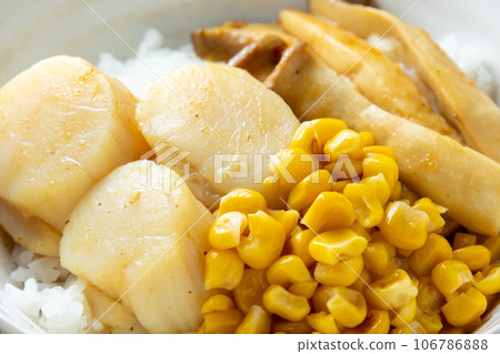 A close-up of the scallop rice bowl (with corn and oyster mushrooms). A close-up of the scallop rice bowl (with corn and oyster mushrooms). 106786888