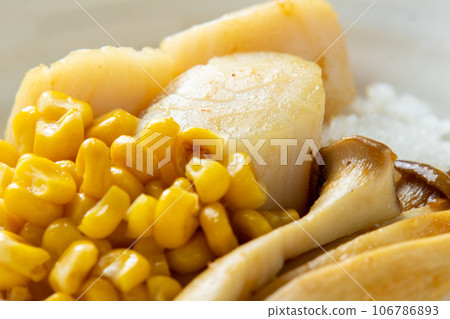 A close-up of the scallop rice bowl (with corn and oyster mushrooms). A close-up of the scallop rice bowl (with corn and oyster mushrooms). 106786893