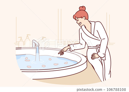 Woman stands near tub filled with flower petals, getting ready for aromatic SPA treatment Woman stands near tub filled with flower petals, getting ready for aromatic SPA treatment 106788108