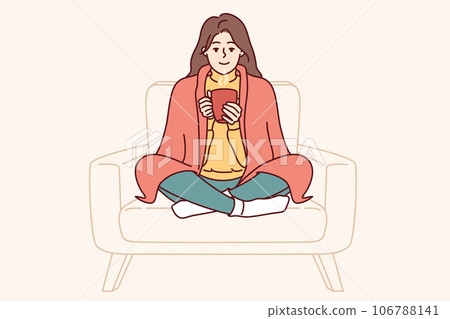 Woman with blanket on shoulders drinks hot tea to cheer up and feel in warm and cozy atmosphere Woman with blanket on shoulders drinks hot tea to cheer up and feel in warm and cozy atmosphere 106788141