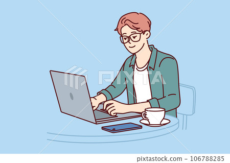 Man freelancer works with laptop sitting in cafe and drinking coffee, enjoying remote work 106788285