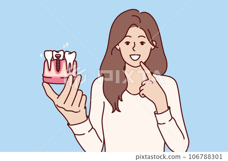 Woman demonstrates model of dental implant and offers to make appointment with dentist 106788301