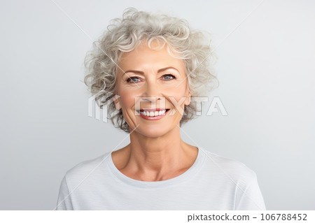 Happily smiling middle aged Caucasian woman. She radiates health and energy of happiness. Happily smiling middle aged Caucasian woman. She radiates health and energy of happiness. 106788452