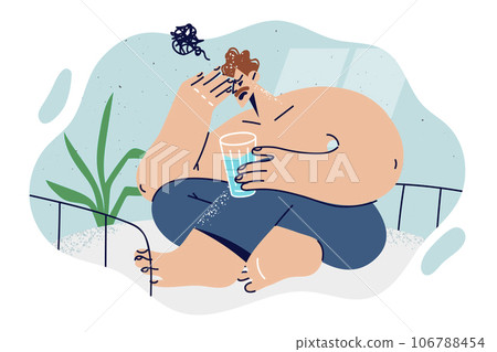 Man woke up from nightmare and sits on bed in bedroom with glass of water in hands Man woke up from nightmare and sits on bed in bedroom with glass of water in hands 106788454