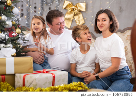 Portrait of family who is satisfied of gifts in time celebration New Year at home 106788895