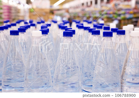 Rows of bottles of beer 106788900