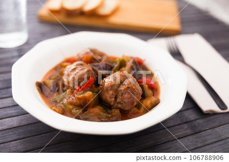 Steamed meatballs with stewed vegetables on plate Steamed meatballs with stewed vegetables on plate 106788906