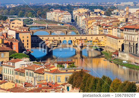 Panoramic view of medieval stone bridge Ponte Vecchio over Arno river in Florence, Tuscany, Italy. View from Michelangelo Hill 106789207