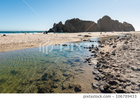 Rock at Pfeiffer Beach in Big Sur, California, at riparian area, Montrey, Pacific Rock at Pfeiffer Beach in Big Sur, California, at riparian area, Montrey, Pacific 106789433
