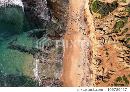 Aerial view of sunny rock and Pacific water at Sunset Cliffs, in San Diego, California 106789437
