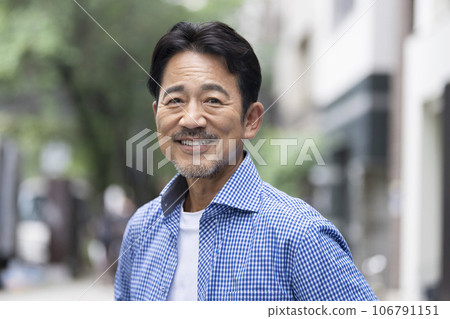 A man in his 50s smiling at the camera A man in his 50s smiling at the camera 106791151