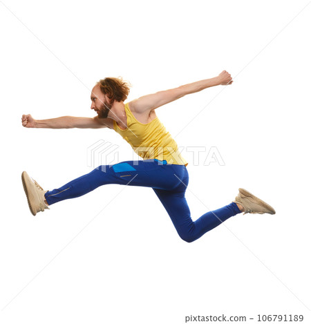 Young man in sportswear running in a jump isolated on white background. Overcoming difficulties. Motivation Young man in sportswear running in a jump isolated on white background. Overcoming difficulties. Motivation 106791189