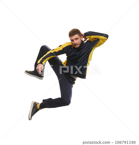 Stylish young man in sportswear jumping and looking at camera isolated on white background 106791190