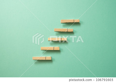 Stairs wood clip on green background. achievement, development, challenge concept 106791603