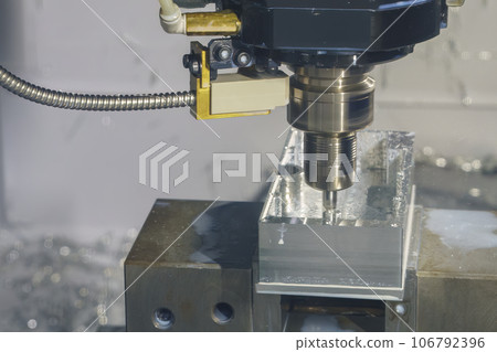 The CNC milling machine rough cutting the aluminum housing with flat end mill tool. 106792396