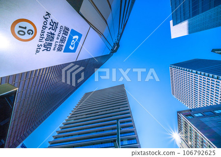 Japan's Tokyo cityscape: A ray of hope and an end to the coronavirus. View of Kyobashi Station and office buildings (redevelopment...). Towards a new future 106792625