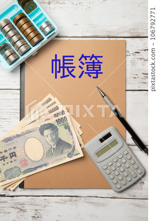 Image of accounting ledger, cash and calculator Image of accounting ledger, cash and calculator 106792771